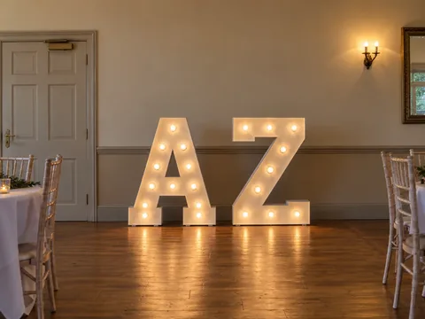Four-foot illuminated A and Z letters in a wedding venue